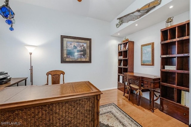 office area with lofted ceiling and light hardwood / wood-style flooring