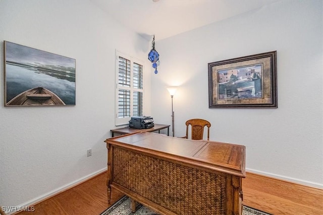 office area with hardwood / wood-style floors