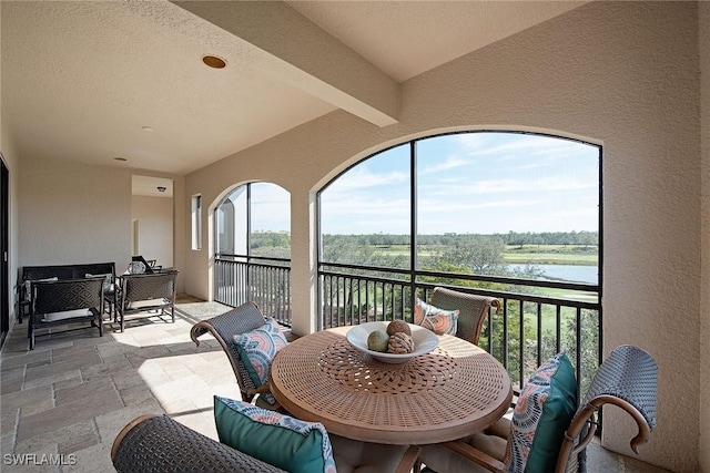 2546 Marquesa Royale Ln Unit 7-302, Naples, FL 34109 - sunroom with a water view and beam ceiling