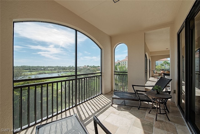 sunroom with a water view