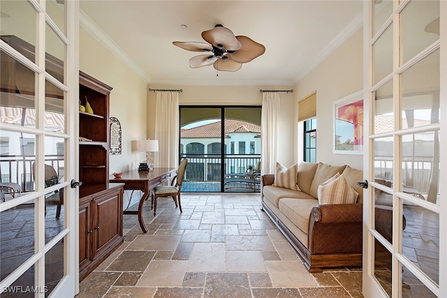 sunroom / solarium featuring french doors, ceiling fan, and plenty of natural light