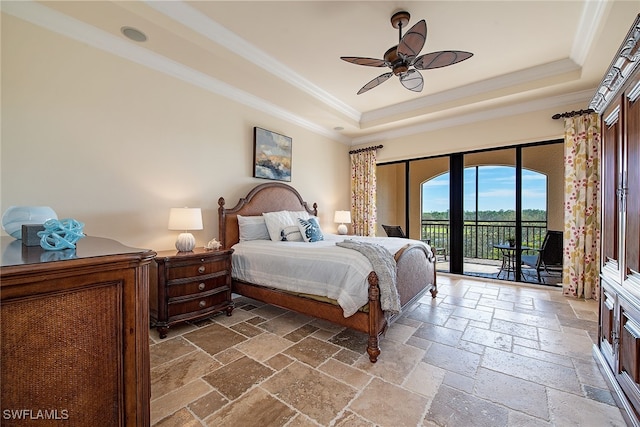 bedroom with access to outside, ornamental molding, a tray ceiling, and ceiling fan