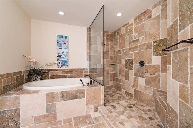 2546 Marquesa Royale Ln Unit 7-302, Naples, FL 34109 - bathroom featuring a bath, recessed lighting, and tiled shower