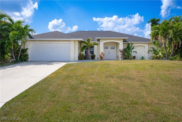 view of front facade with a front yard and a garage