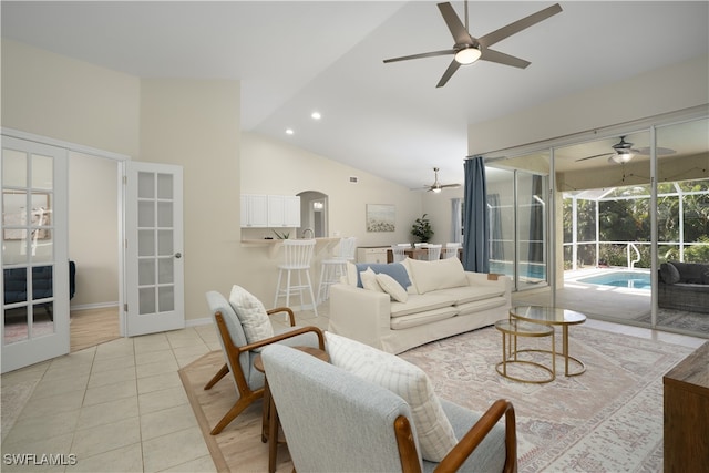 living room featuring french doors, ceiling fan, high vaulted ceiling, and light tile patterned floors