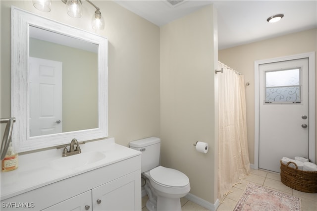 bathroom featuring vanity, toilet, tile patterned flooring, and a shower with shower curtain