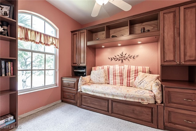 sitting room with lofted ceiling, light carpet, and ceiling fan