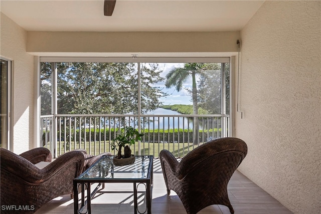 sunroom with a water view