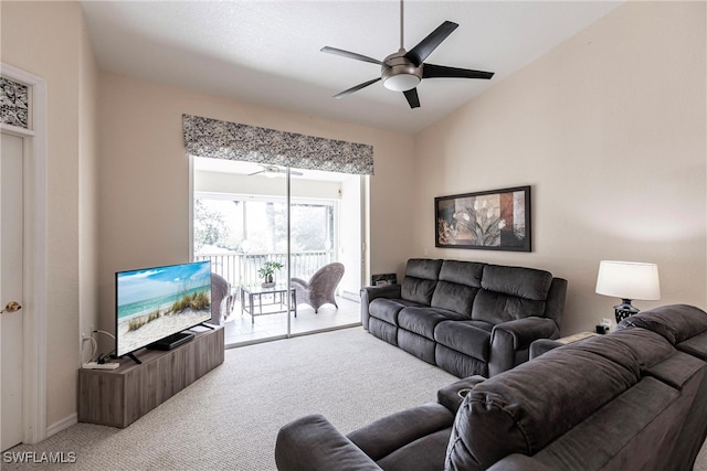 living room with vaulted ceiling, carpet floors, and ceiling fan