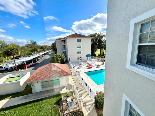 view of pool featuring fence