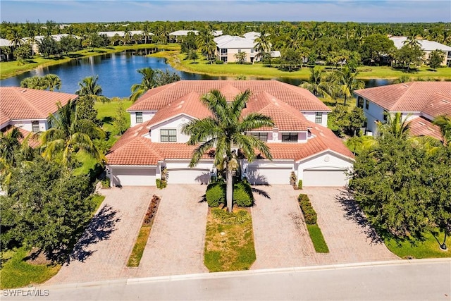 3157 Aviamar Cir Unit 102, Naples, FL 34114 - bird's eye view of a large body of water and a tree filled landscape