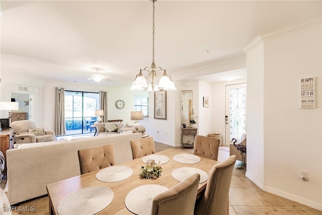 3157 Aviamar Cir Unit 102, Naples, FL 34114 - dining area featuring a chandelier, light tile patterned floors, and baseboards