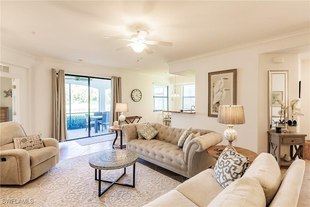 3157 Aviamar Cir Unit 102, Naples, FL 34114 - living room with ceiling fan, crown molding, plenty of natural light, and tile patterned floors