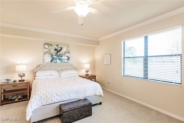 carpeted bedroom featuring ornamental molding and ceiling fan