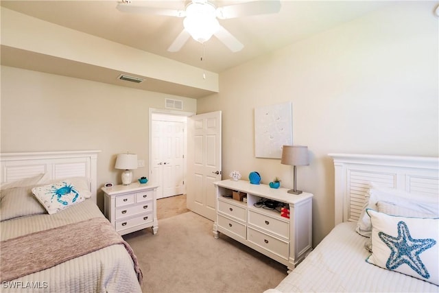3157 Aviamar Cir Unit 102, Naples, FL 34114 - bedroom featuring light carpet and ceiling fan