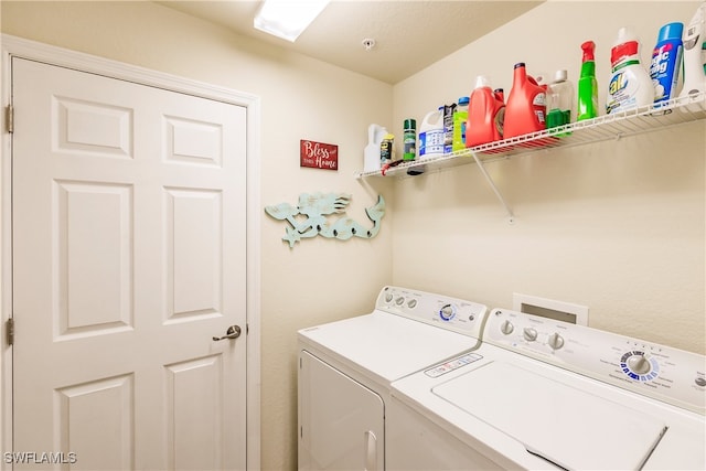 laundry room with independent washer and dryer