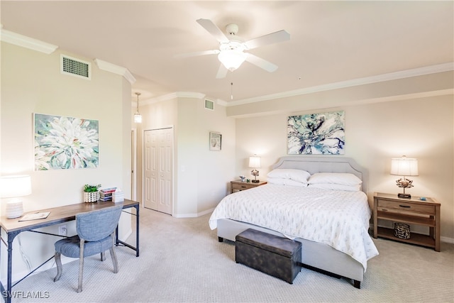 carpeted bedroom featuring a closet, ceiling fan, and ornamental molding