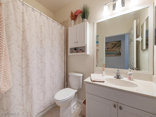 bathroom featuring vanity, toilet, and walk in shower