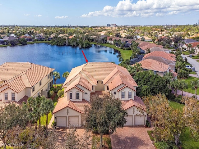 birds eye view of property with a water view