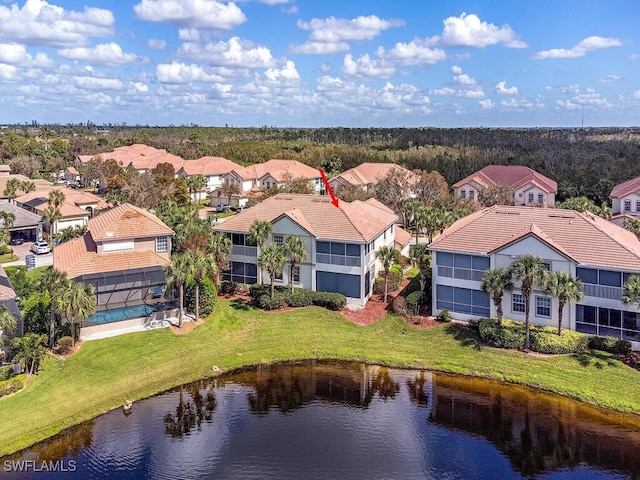 birds eye view of property with a water view