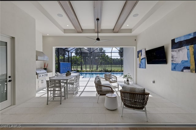 view of patio with grilling area and glass enclosure