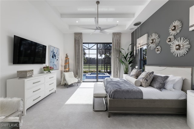 bedroom with access to outside, light colored carpet, a raised ceiling, and ceiling fan