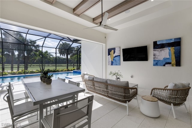 view of patio / terrace with ceiling fan, a lanai, and an outdoor hangout area