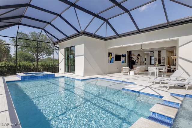 view of swimming pool with a lanai, a ceiling fan, a pool with connected hot tub, a patio area, and outdoor lounge area