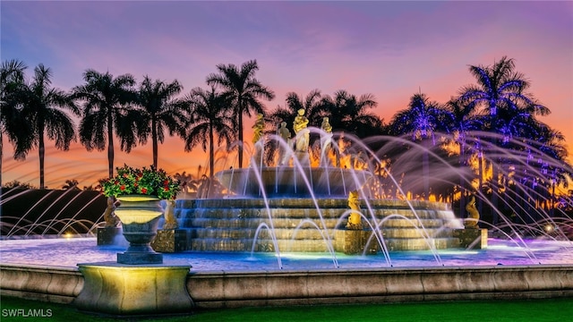 view of pool at dusk