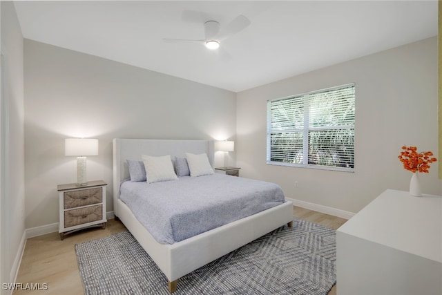 bedroom featuring light hardwood / wood-style flooring and ceiling fan