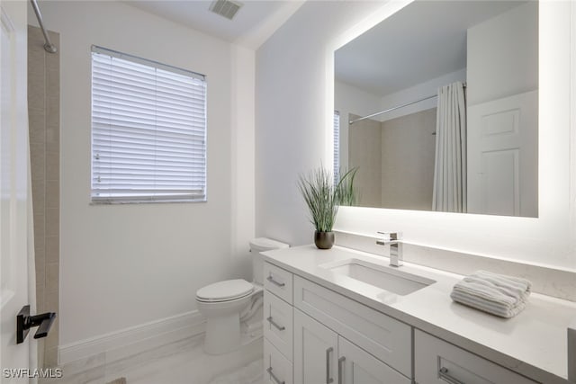 bathroom with vanity, toilet, and a shower with curtain