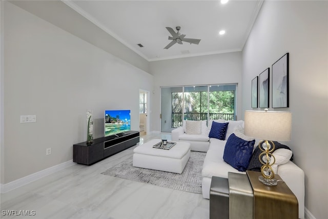 living room featuring crown molding, a high ceiling, hardwood / wood-style floors, and ceiling fan