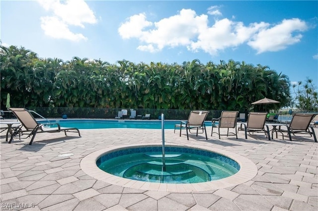 view of pool featuring a community hot tub and a patio