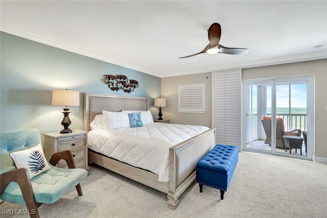 carpeted bedroom with ceiling fan, a water view, crown molding, and access to outside