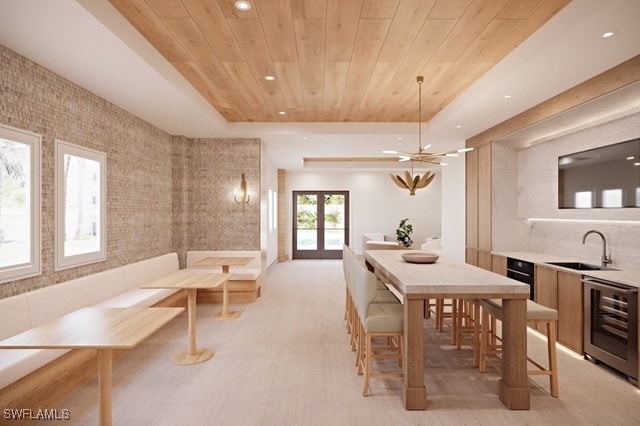 dining room with sink, french doors, wooden ceiling, beverage cooler, and tile walls