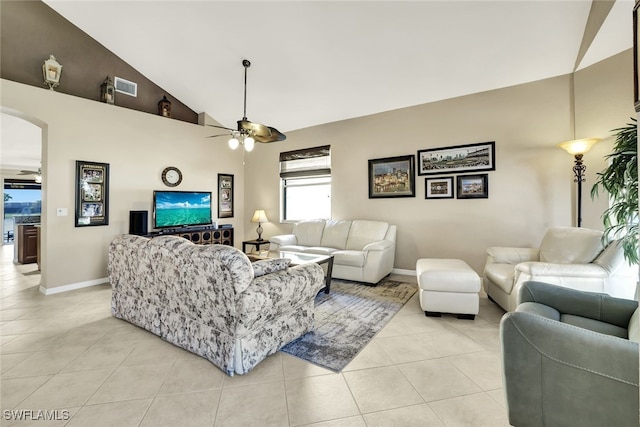 living room featuring ceiling fan, light tile patterned floors, and high vaulted ceiling