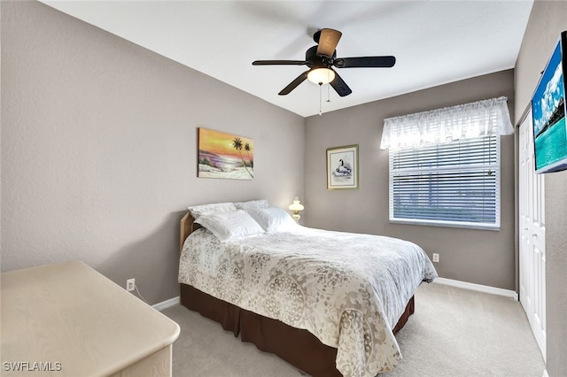 carpeted bedroom featuring ceiling fan