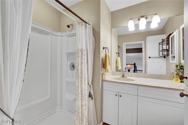 bathroom with vanity and curtained shower