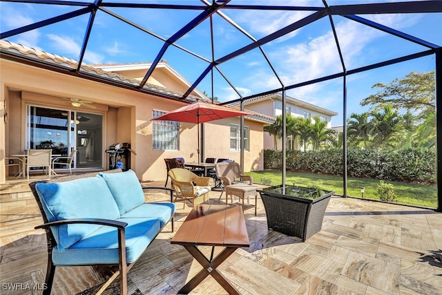 view of patio / terrace with an outdoor hangout area and glass enclosure