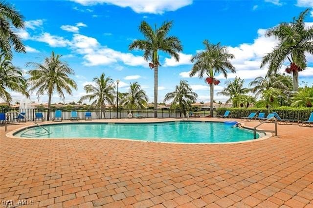 view of swimming pool with a patio area