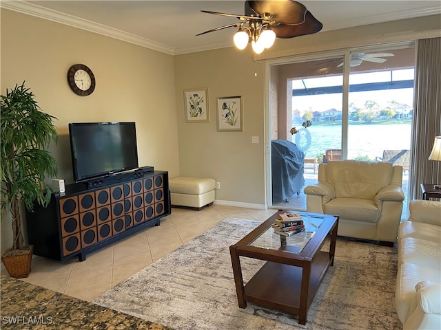 living room with ceiling fan, crown molding, and light tile patterned flooring