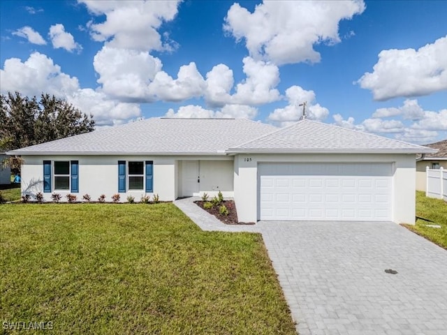 ranch-style home with a front lawn and a garage