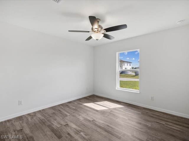 unfurnished room with ceiling fan and hardwood / wood-style floors