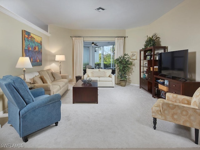 living room with light colored carpet, ceiling fan, and crown molding