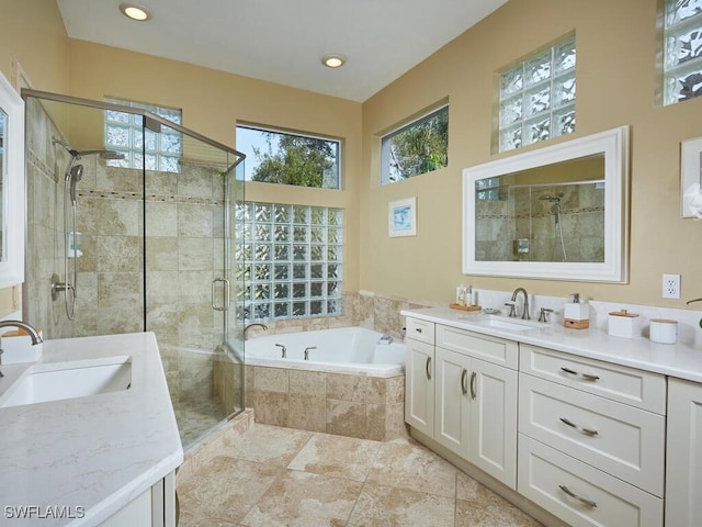 bathroom with tile patterned flooring, vanity, and plus walk in shower