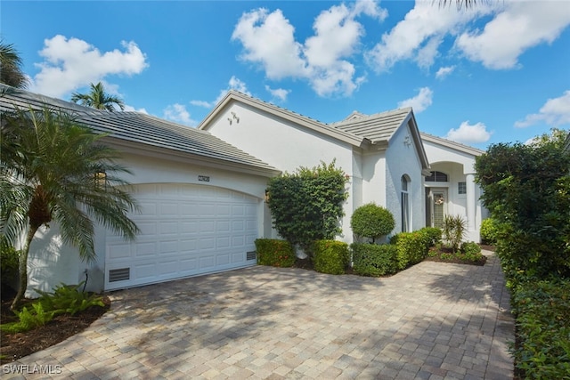 view of side of home featuring a garage