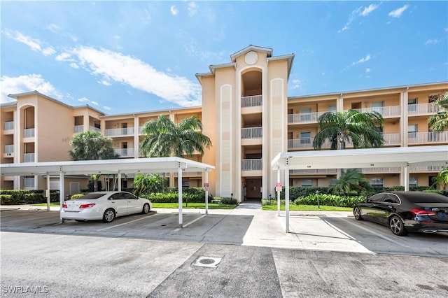 view of property featuring covered parking