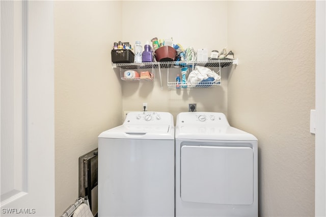 laundry room featuring washer and clothes dryer