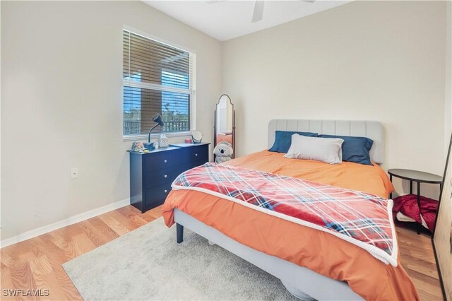 bedroom featuring light hardwood / wood-style floors and ceiling fan