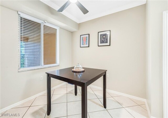 unfurnished office featuring ornamental molding, light tile patterned flooring, and ceiling fan